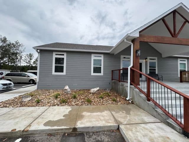 White Gutters on an Accessible Commercial Building shown in dcGutterPRO project photo 1