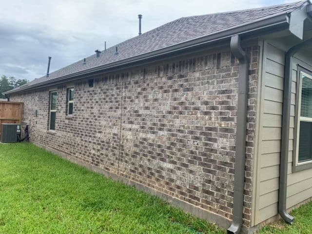 Bronze Gutters and Downspouts on a Brick Home shown in dcGutterPRO project photo 1