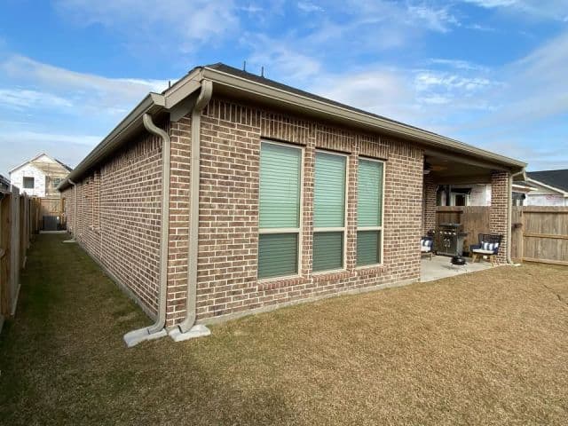 Six-Inch Seamless Gutters for a New Brick Home shown in dcGutterPRO project photo 1