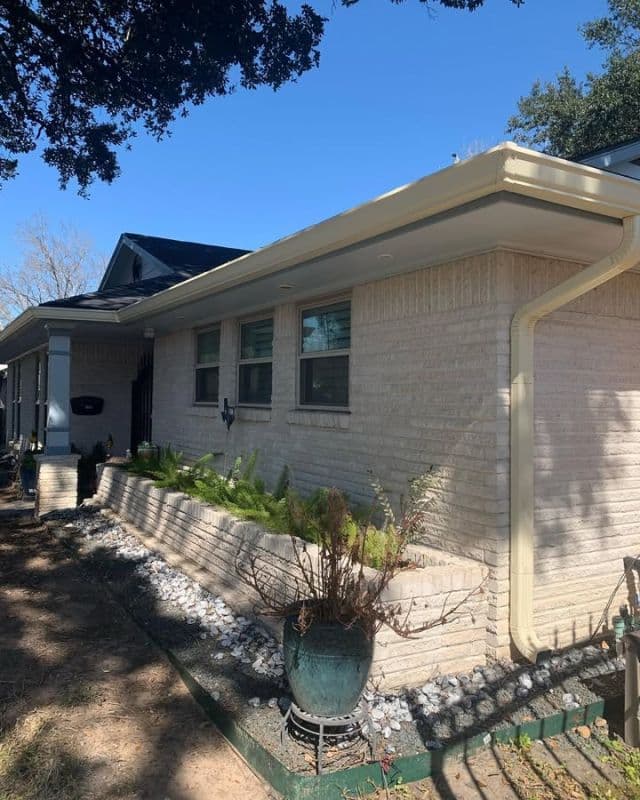 Seamless Gutter Installation on a Light-Brick Home shown in dcGutterPRO project photo 1